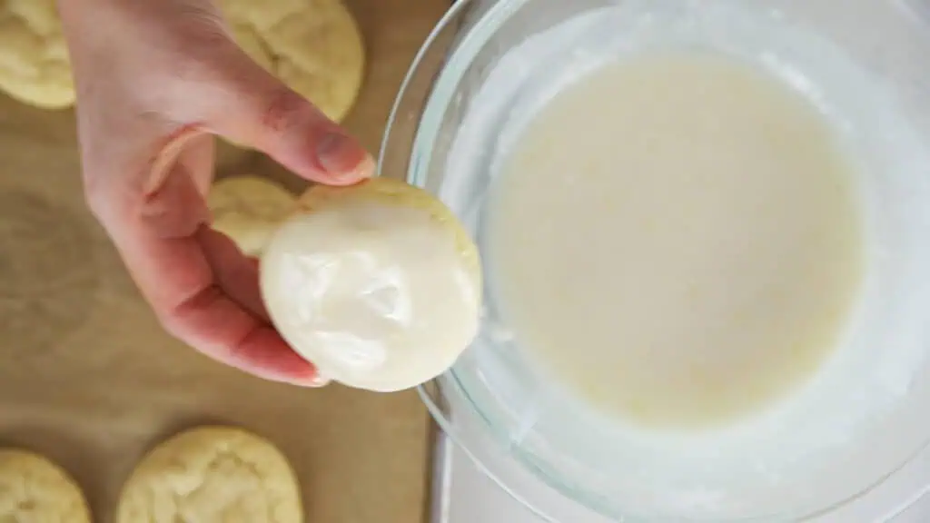 diping the cookies in icing